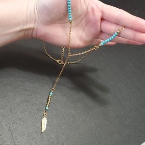 **Final Sale** Gold tone feather turquoise necklace